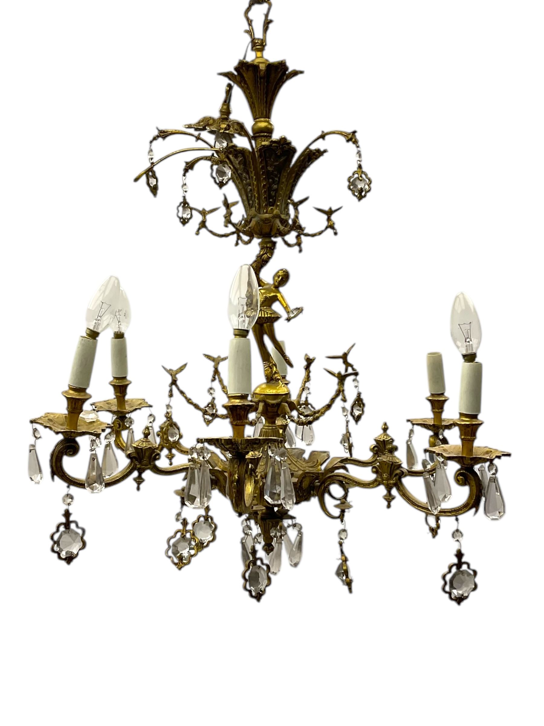 Gilt metal six branch ceiling light, the central stem modelled as a ballerina, decorated with glass pendants 