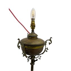 Victorian brass converted oil lamp stand, telescopic stem with scrolled uprights terminating to scrolled feet, dished base decorated with scrolling cast metal work and grotesque masks 