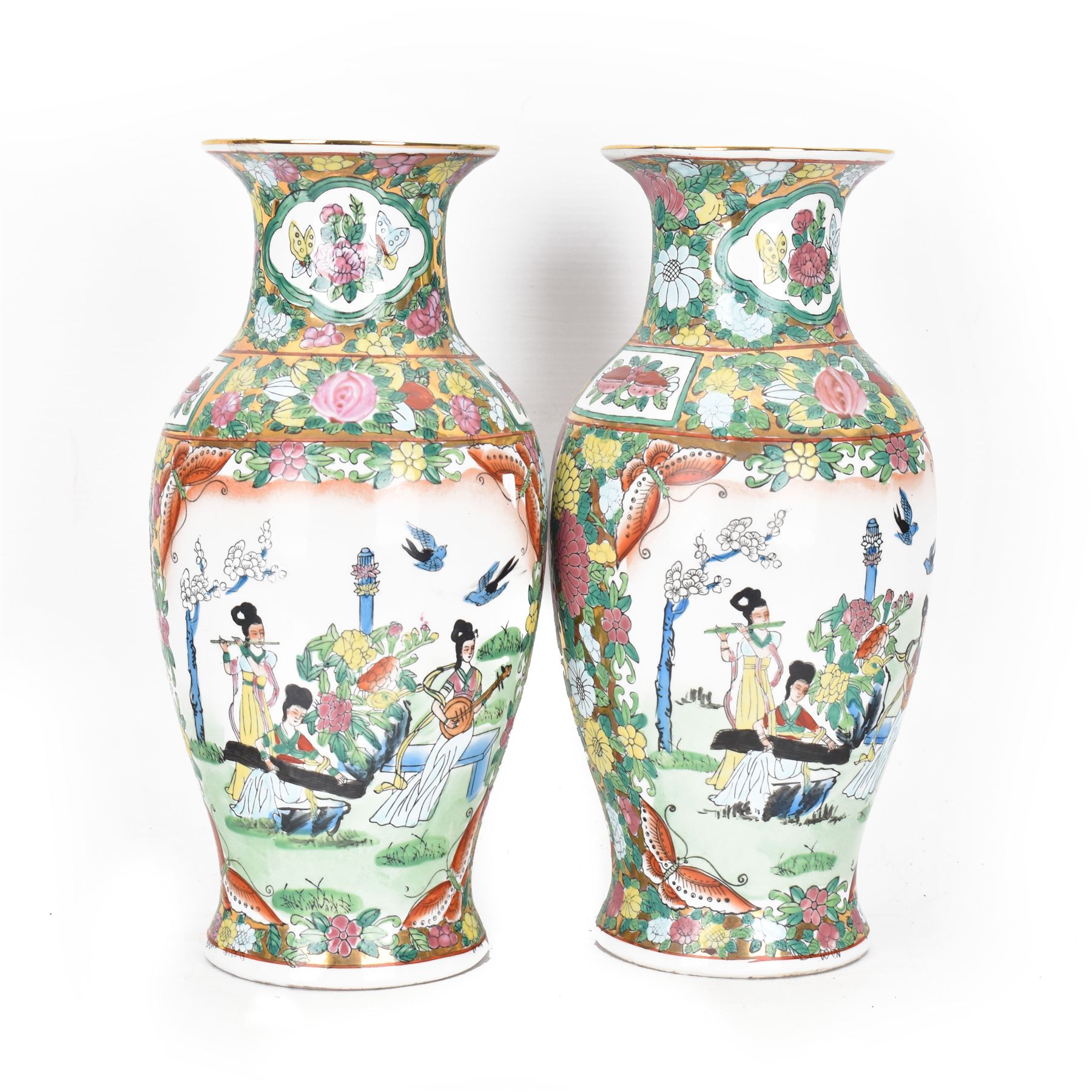 Pair of Famille Rose vases of baluster form, decorated with panels depicting musicians, H30cm