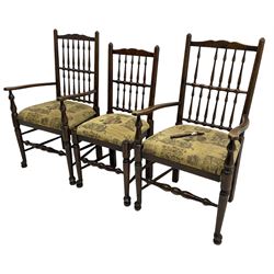 Set of six (4+2) 20th century oak spindle back dining chairs, with upholstered drop-on seat cushions, turned supports joined by turned stretchers