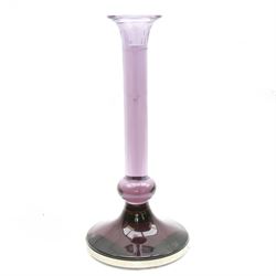 Large heavy gauge Scandinavian amethyst glass candlestick, the plain column with flared rim and basel knop, upon a spreading circular base, H44cm