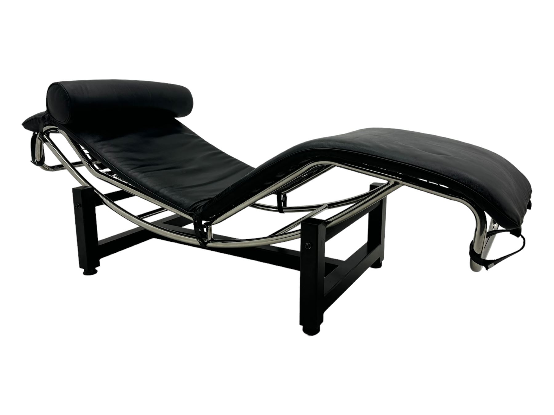 After Le Corbusier, Pierre Jeanneret, and Charlotte Perriand - LC4 chaise longue, black leather upholstery with cylindrical headrest, supported by a chromed tubular steel frame, with cantilever design with elastic webbing