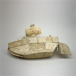 A Japanese carved ivory model of a sailing boat, surmounted by three carved figures (a/f), L22.5cm, together with a smaller sail boat with malachite hull and ivory sails and rudder, H18cm. 