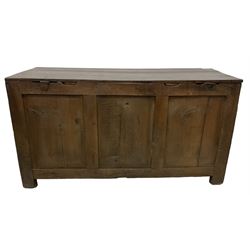 Large 18th century oak coffer or blanket box, hinged lid over triple panelled front, panelled back and sides, on stile supports 