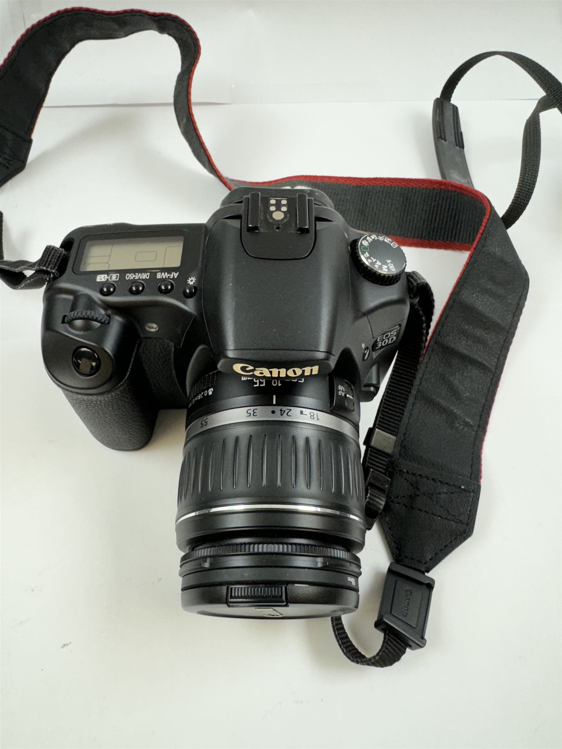 Canon AE-1 camera body, serial no. 3484113, with a Canon Zoom Lens FD 35-70mm 1:4, serial no. 103833, together with a Canon EOS 30D camera body, serial no. 1230810818, with a   Canon Zoom Lens EF-S 18-55mm 1:3.5-5.6 II, serial no. 2140596539, in Tuf Foto Pro carry case, with accessories 