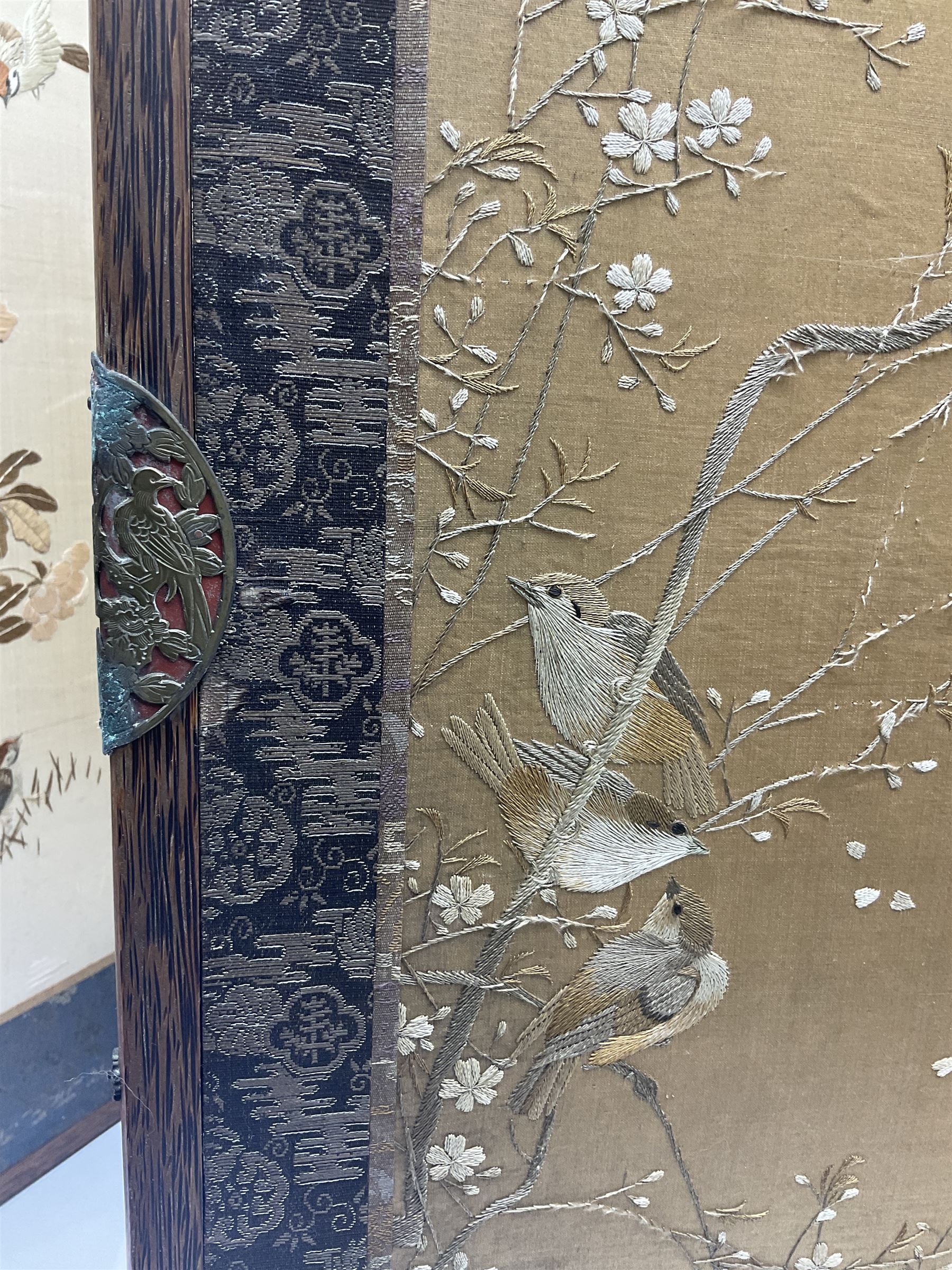 Two Oriental silk and wooden screens embroidered with birds and blossoming branches, largest H88cm 