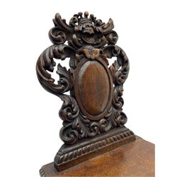 19th century oak hall chair, shaped and pierced back carved with crown cresting over curled and scrolled acanthus leaves, tapered rectangular seat with foliate carved corners and fluted chamfered edge, on turned and lobe carved splayed supports 