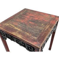 Late 19th century Chinese Qing dynasty red and black lacquered wood tall tea table, Shanxi region, square top over geometric scroll fretwork panels, on square supports with hoof feet 