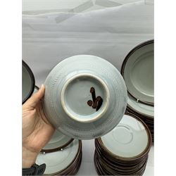 20th century celadon dinner service with iron rim, comprising nineteen dinner plates 26.5cm, twenty-four side plates D24cm, twelve varying bowls, twenty-two tea plates and fifteen saucers 