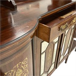 Late Victorian inlaid rosewood mirror back sideboard, shaped cresting rail decorated with scrolling foliate ivorine inlays, over rectangular bevelled mirror, flanked by bow-front glazed cupboards over inlaid 'green man' motifs, the base fitted with single drawer and cylindrical cupboards flanking a mirror panelled cupboard, on square tapering supports