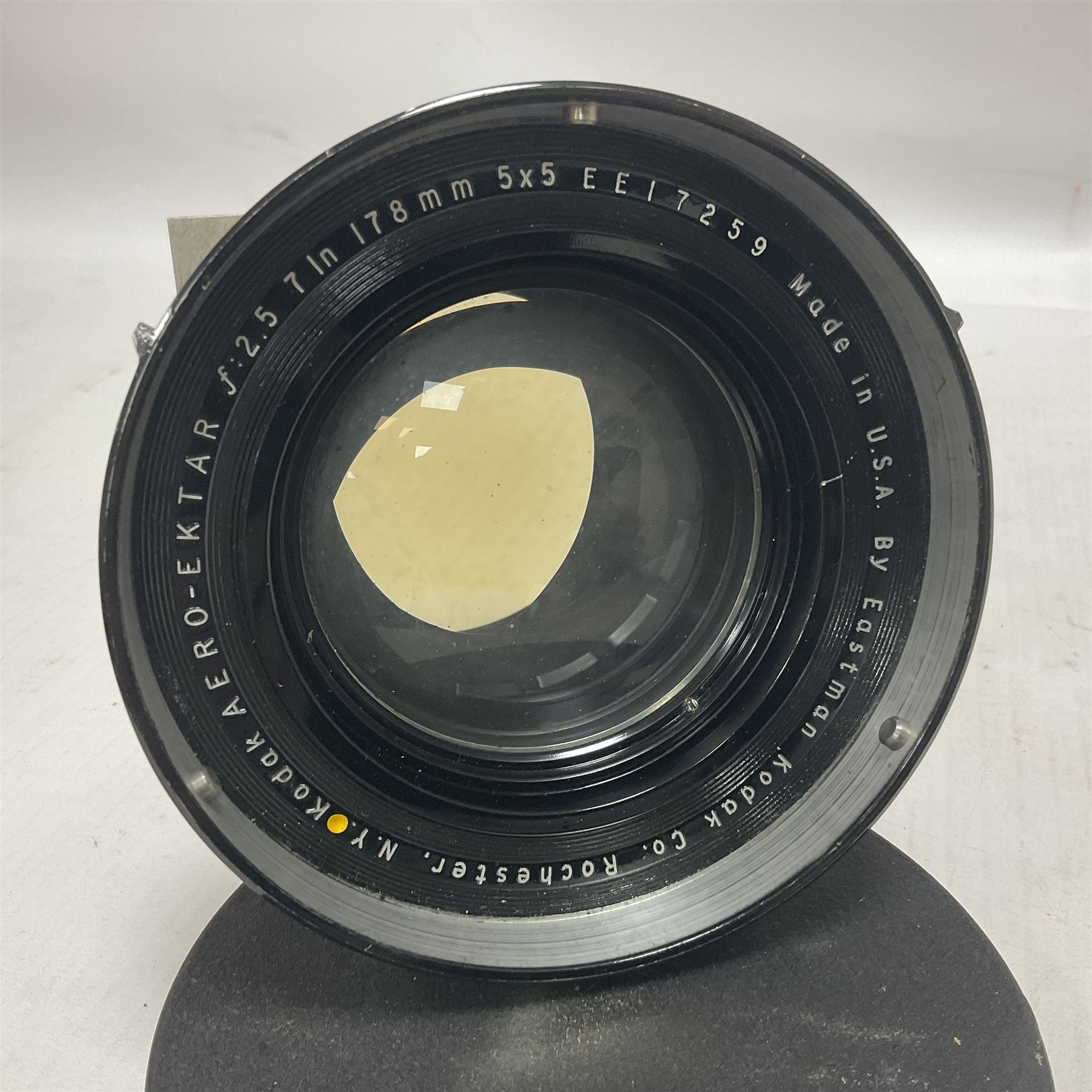 Eastman Kodak Aero-Eketar f:2.5 7In 178mm 5x5 lens, serial no EE17259, together with a WWII Air Ministry aerial camera lens, serial no 206626, F = 14F/5.6, stamped with contract number AM14A/3140