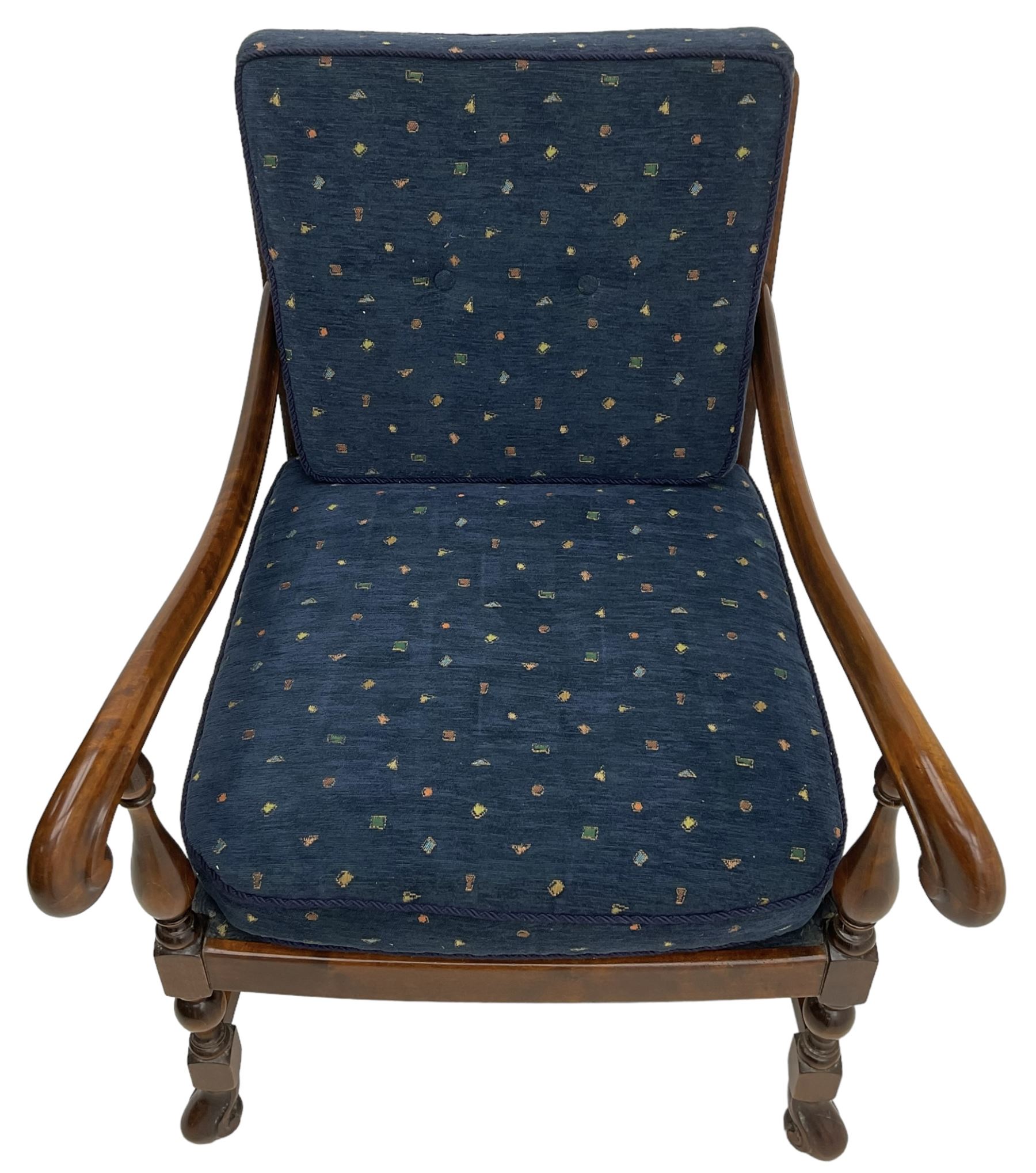 Early 20th century stained beech framed armchair, cane panel back over scrolled arm terminals, raised on turned supports united by turned H-stretcher, with patterned blue upholstered loose back and seat cushions