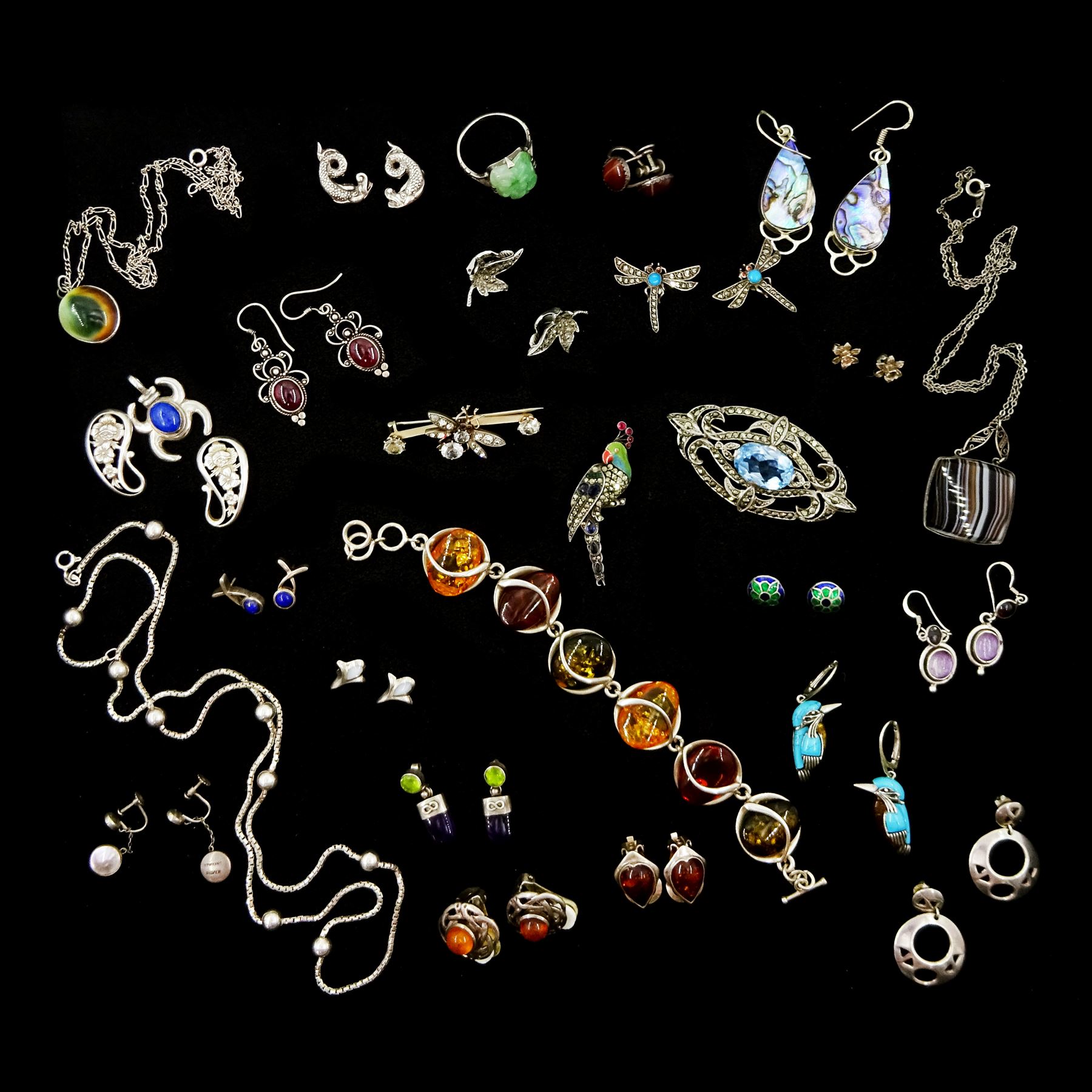 Silver and stone set silver jewellery including amber link bracelet, stone set parrot brooch, pair of kingfisher earrings, paste stone set insect brooch, marcasite and blue stone set brooch, enameled stud earrings, pair of dragonfly earrings, amber clip on earrings, earrings, necklaces etc