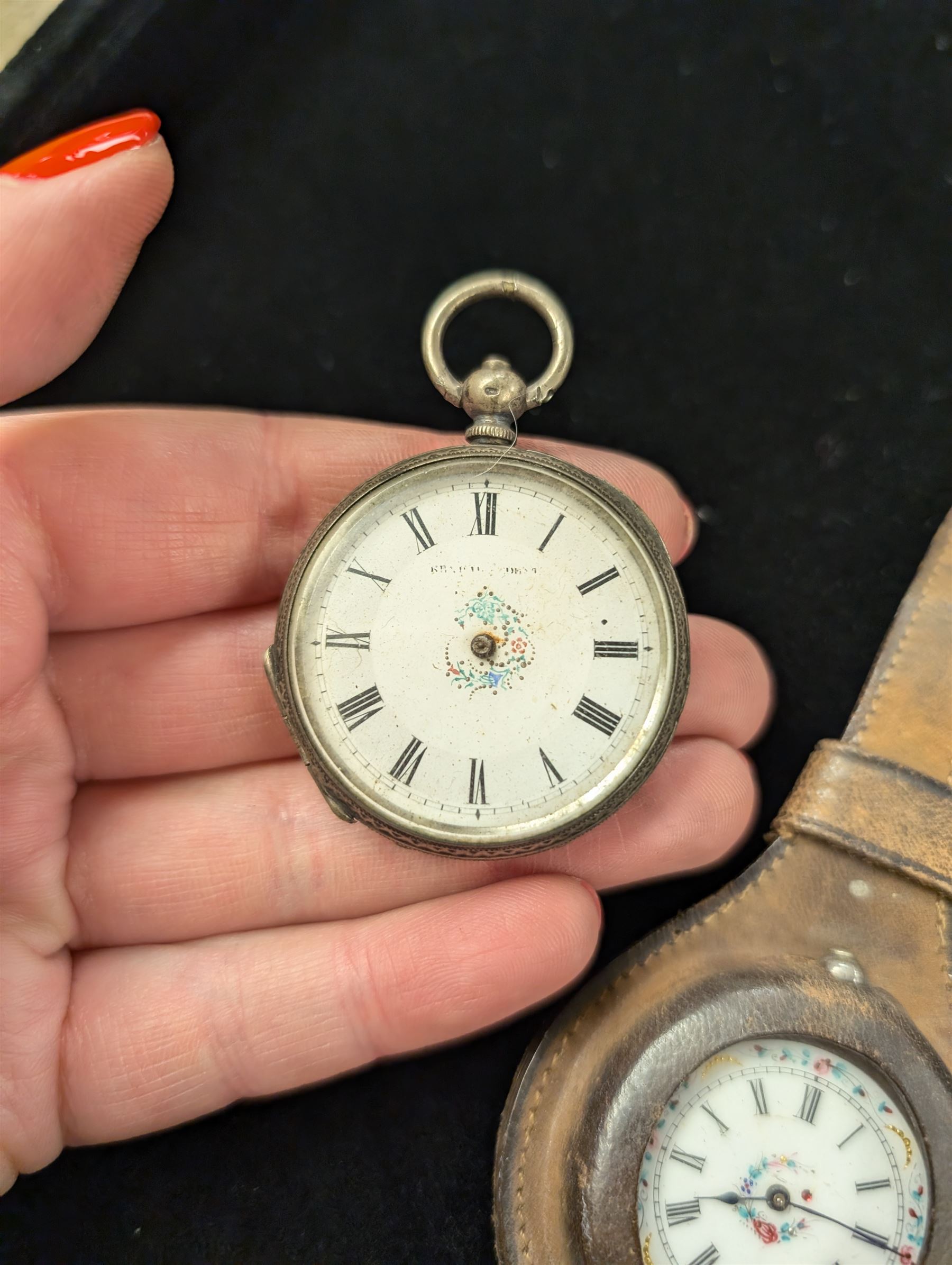 Two continental silver fob watches with enamel dials, one stamped 800, one stamped 935 and in leather wriststrap