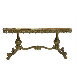 Mid-20th century Italian design Onyx and gilt serpentine coffee table, pierced gilt metal frieze with scrolling decoration, raised on twin end supports with globular turning and foliate decoration united by shaped scroll stretcher