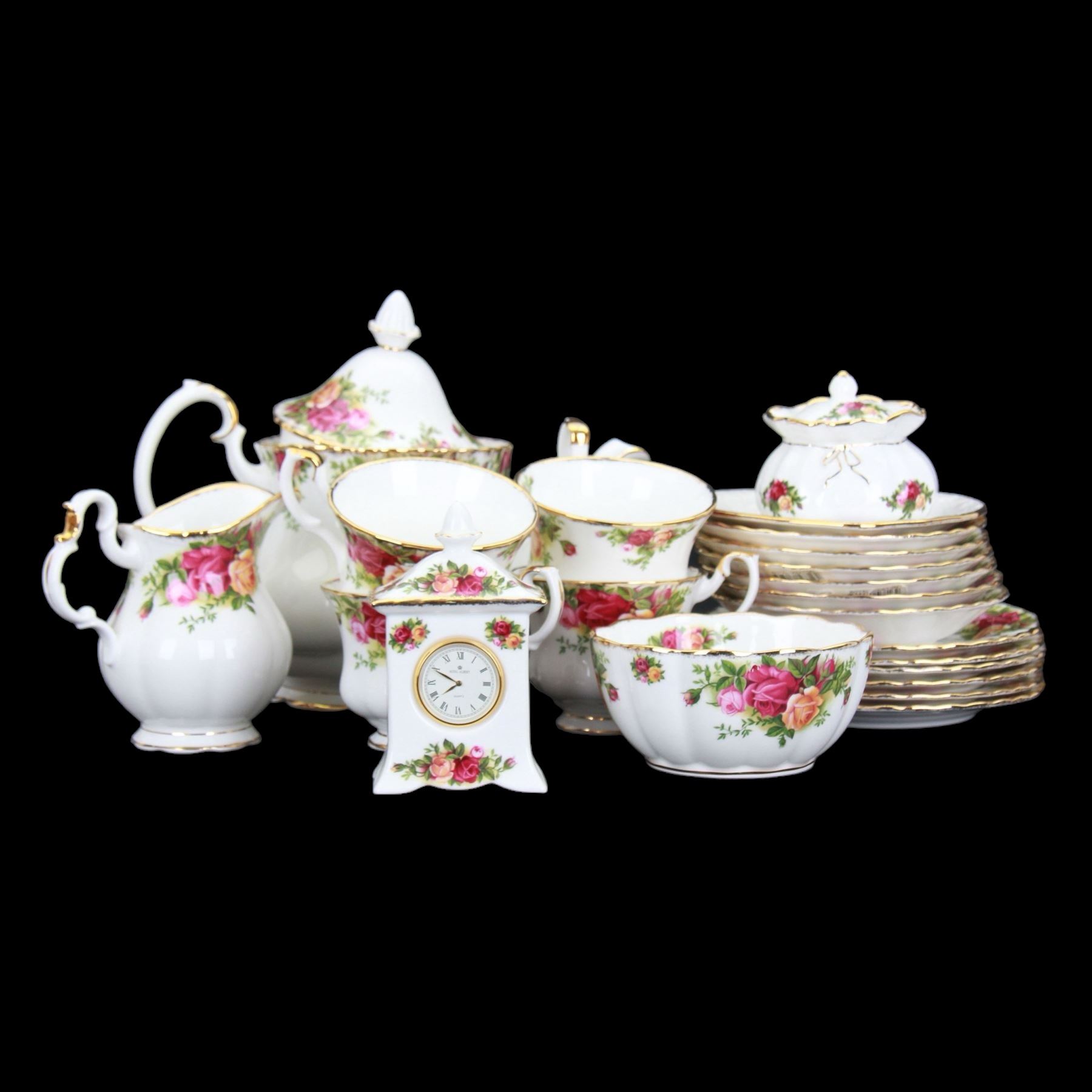 Royal Albert Old Country Roses tea service for six, comprising teapot, milk jug, open sucrier, cups and saucers, dessert plates, two trinket dishes covered jar and clock