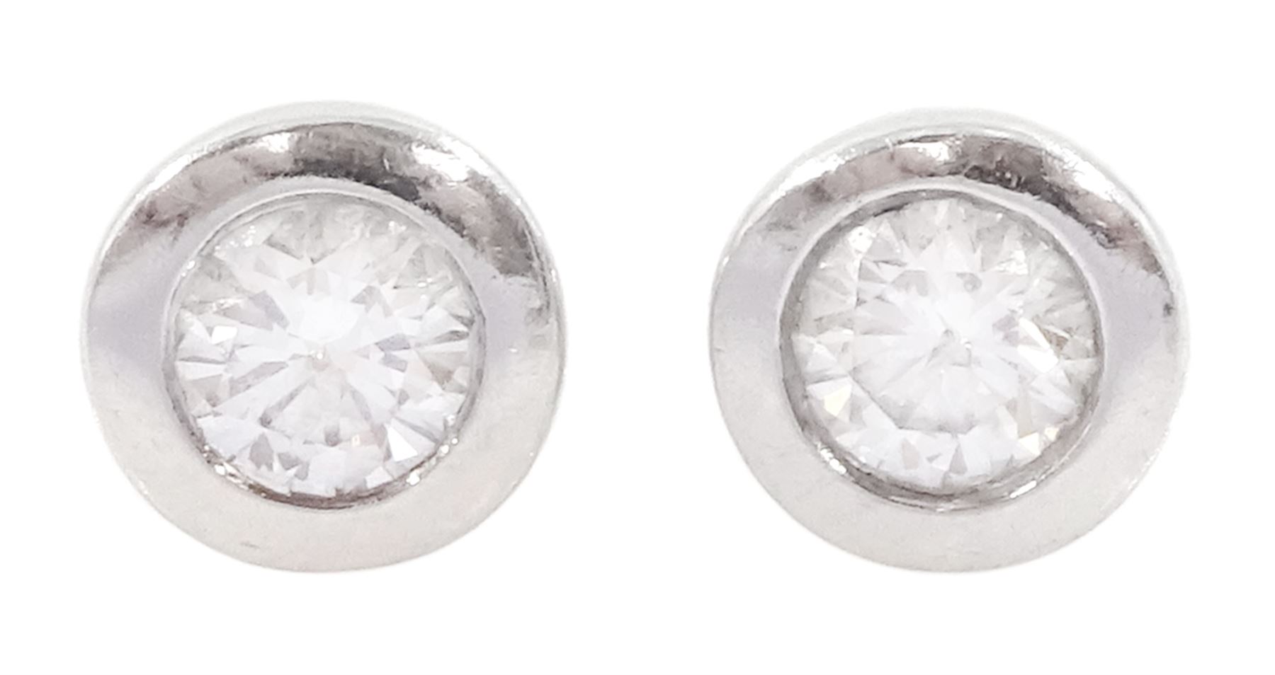 Pair of 9ct white gold bezel set round brilliant cut diamond stud earrings, hallmarked, total diamond weight approx 0.40 carat