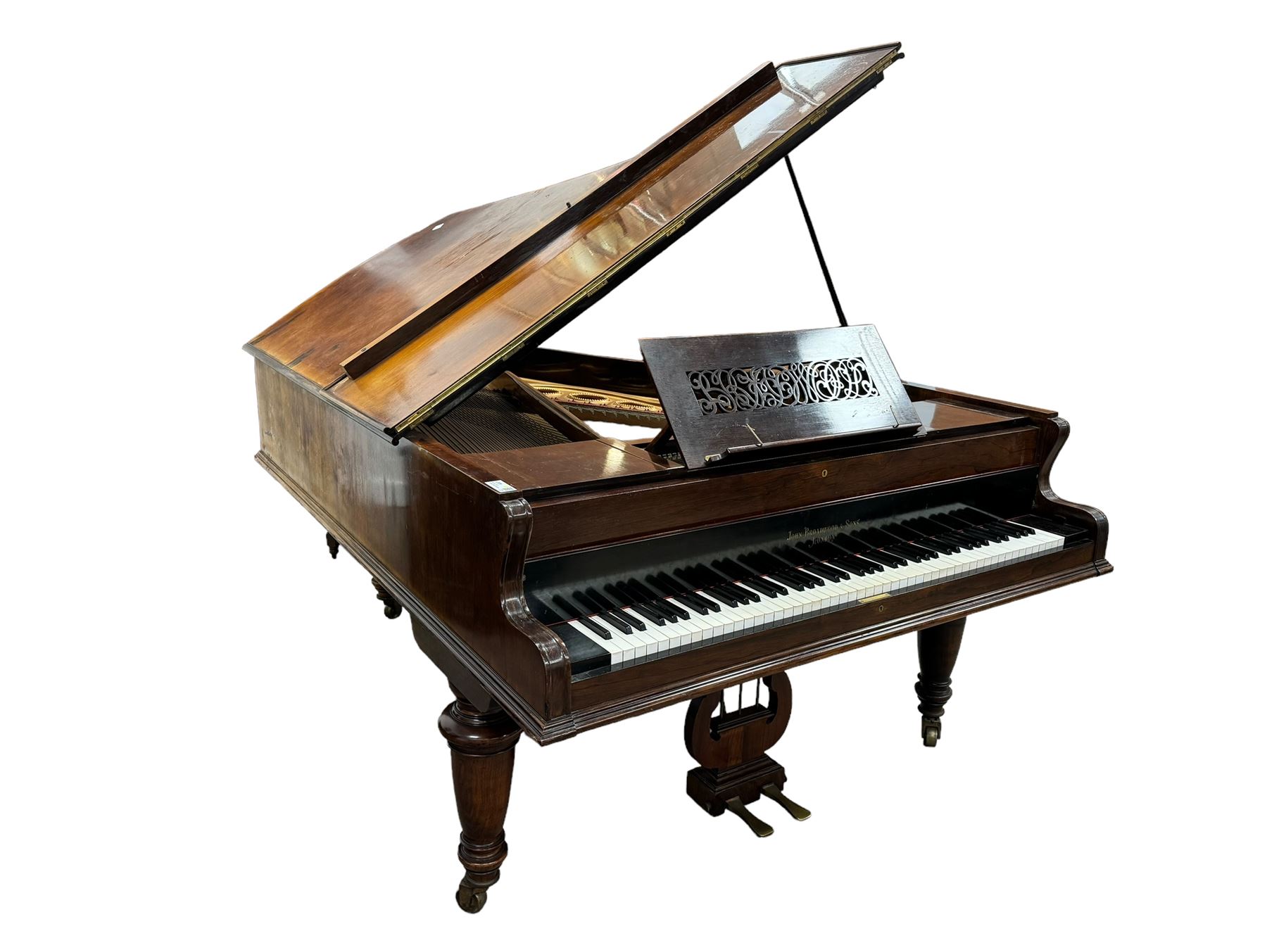 John Broadwood & Sons London - 19th century rosewood grand piano serial  No 47356 (1900-1910) overstrung cast iron frame with 88 notes, 7 octaves, Lyre with sostenuto and una-corda pedals, split-hinged key fall board and fretted music desk, case raised on three taper turned legs with brass castors, original stringing, felt, hammers, dampers and grand roller action.

This item has been registered for sale under Section 10 of the APHA Ivory Act