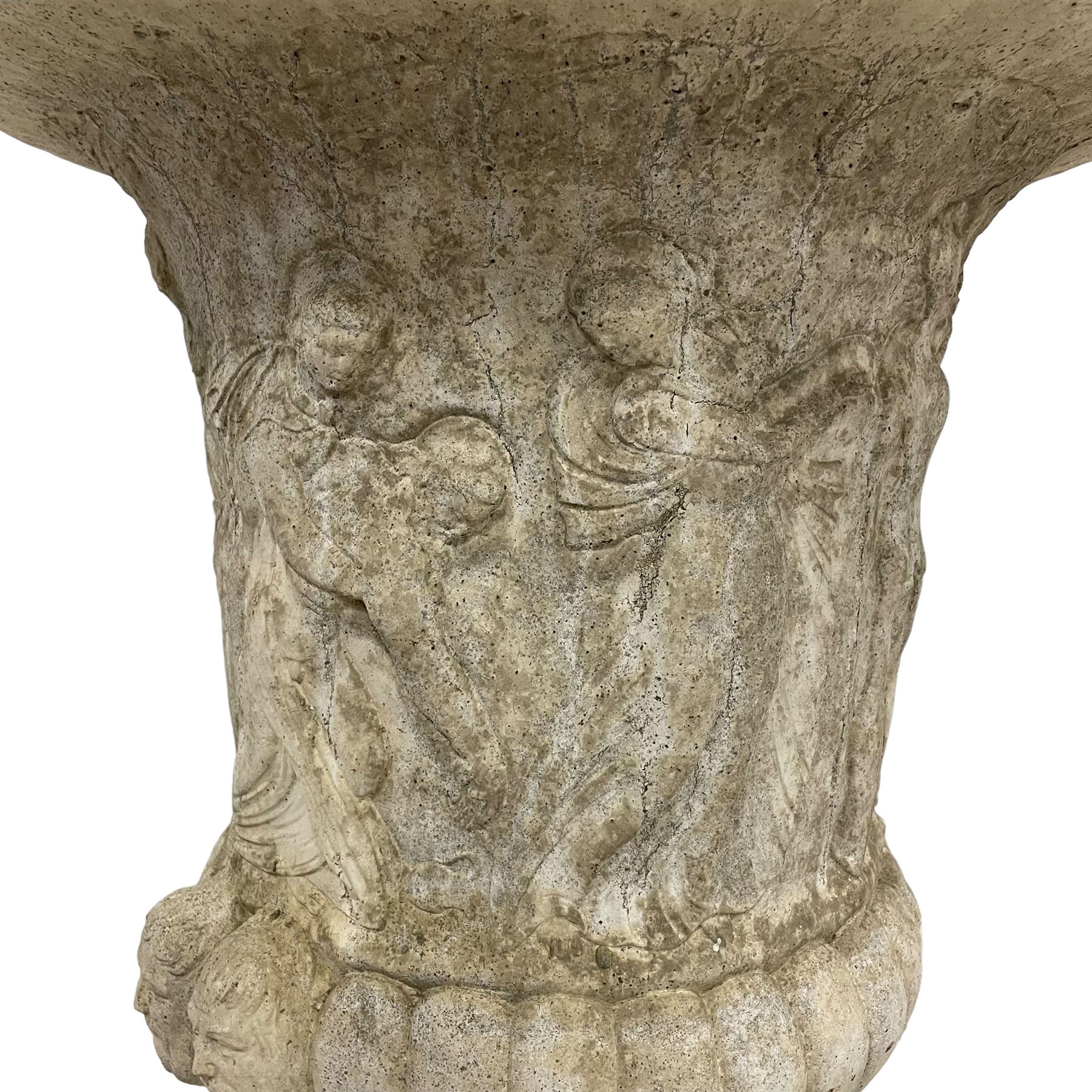 Cast stone Campana shaped urn, decorated with festival scenes over gadrooned underbelly, circular foot on square base