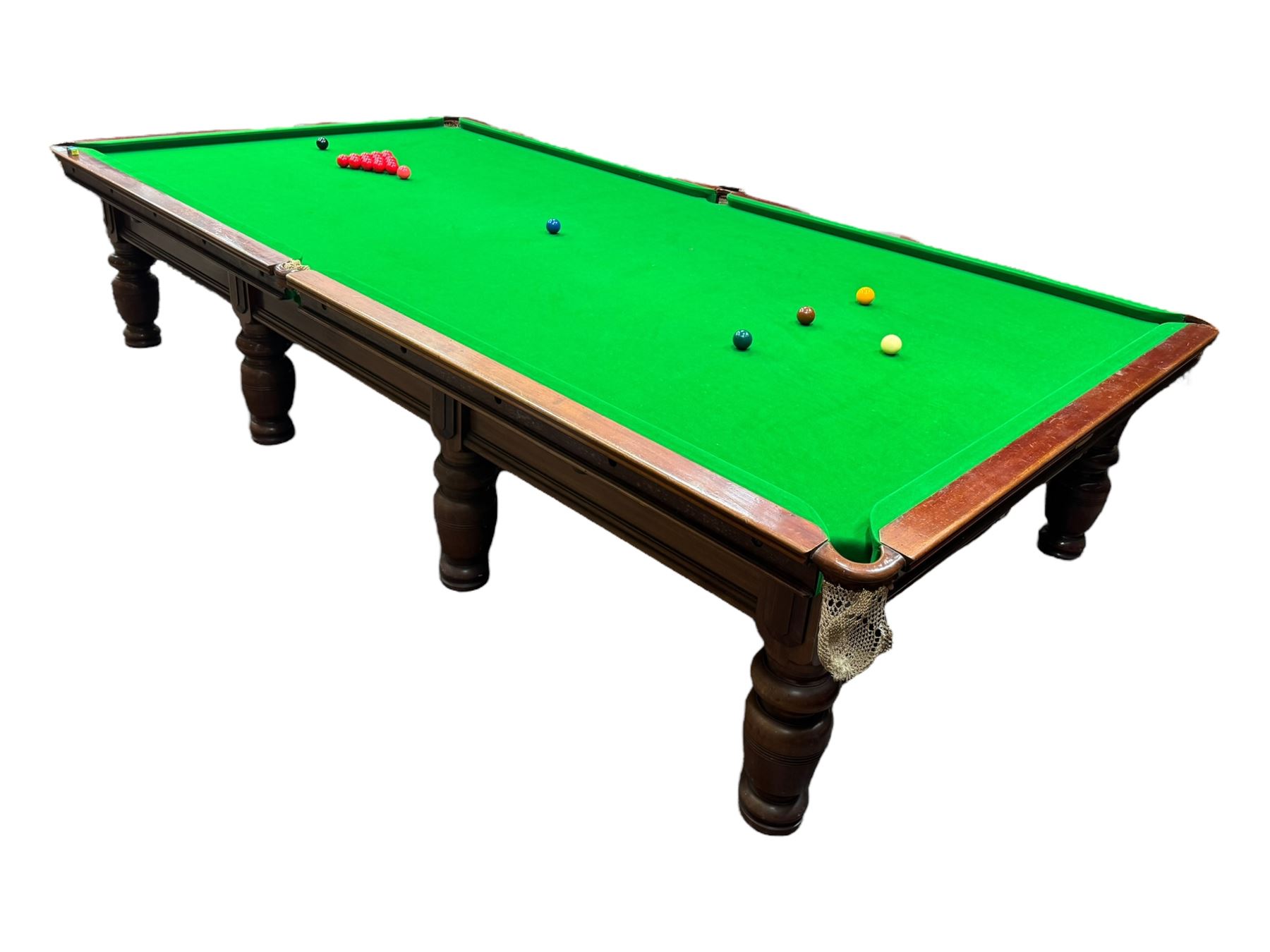 Riley - early 20th century full-sized mahogany billiards or snooker table, on eight turned baluster supports, with cue rack, scoreboard, balls and various cues 