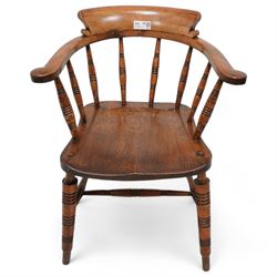 19th century elm and beech Captain's chair, curved back and arms over spindle supports, dished seat on turned supports united by double H-stretcher 