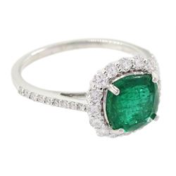 18ct white gold cushion cut emerald and round brilliant cut diamond cluster ring, stamped 750, emerald approx 1.85 carat, total diamond weight approx 0.55 carat