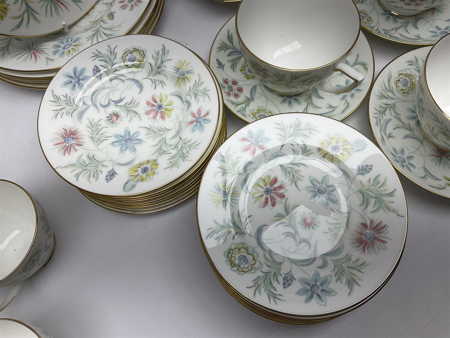 Minton Vanessa pattern part tea service, to include fifteen cups and saucers, open sucrier, milk jug, eighteen dessert plates, twelve side plates etc (70)