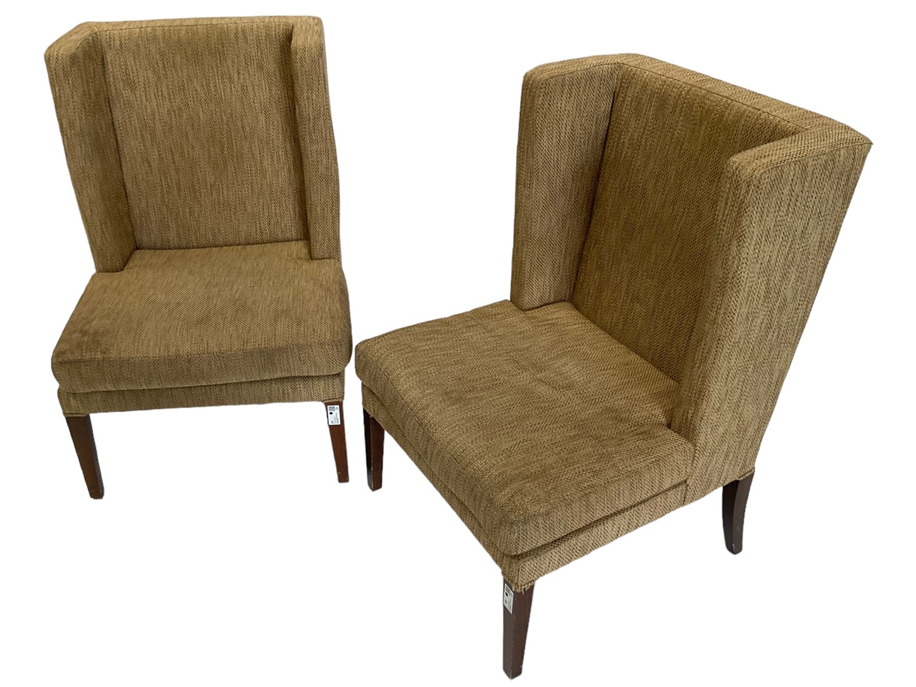 Two wing back armchairs, upholstered in oatmeal fabric