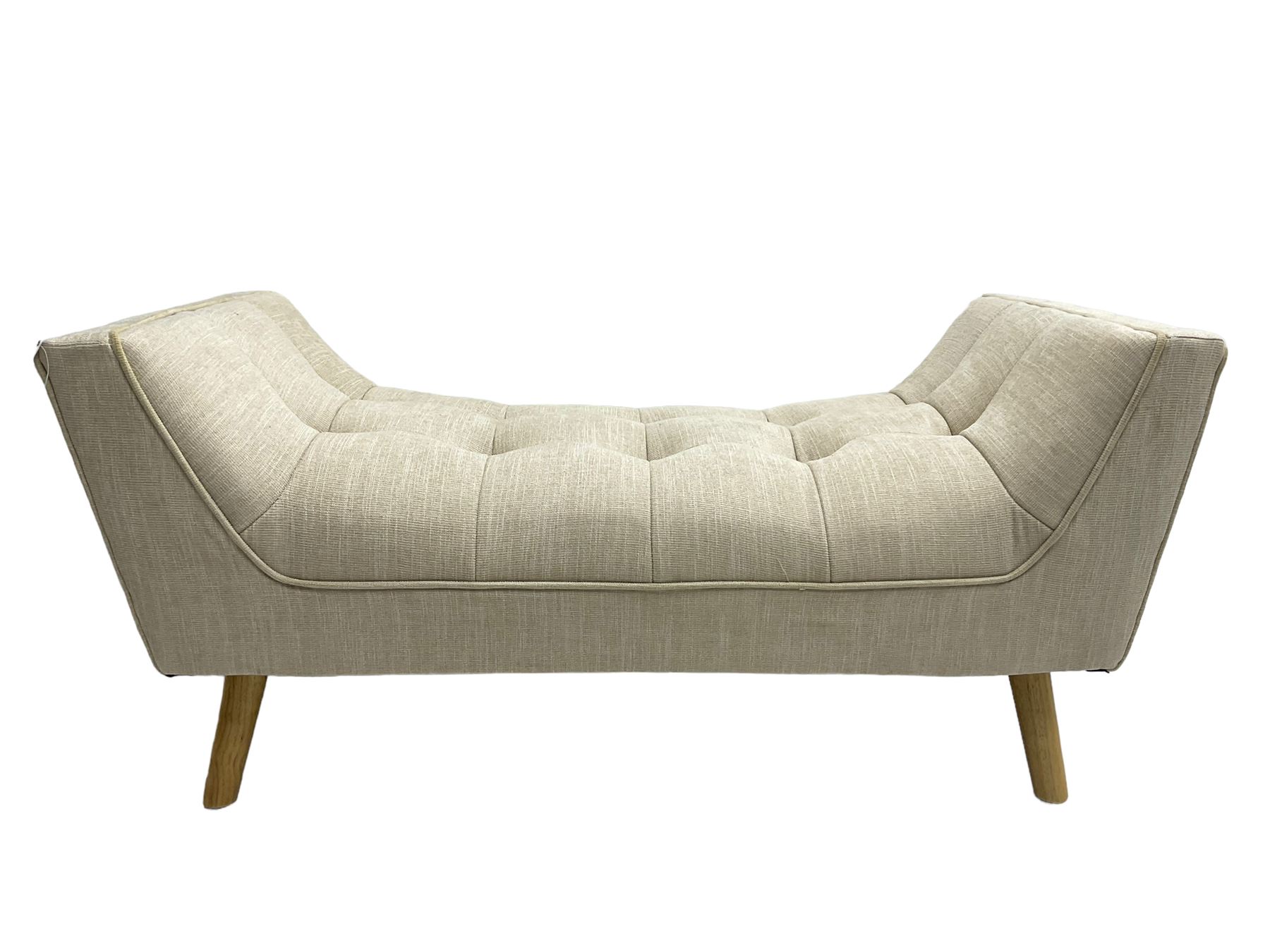 Contemporary U-shaped window or bed stool, upholstered in buttoned neutral fabric