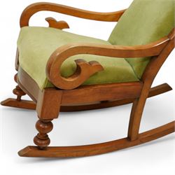 Victorian walnut framed rocking chair, upholstered in sage green buttoned fabric, scrolled arms, on turned front feet with rockers 