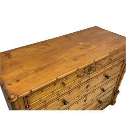 Victorian pine and simulated bamboo chest, fitted with five drawers, the drawer fronts decorated with applied simulated bamboo mounts and turned ebonised handles, on turned front feet