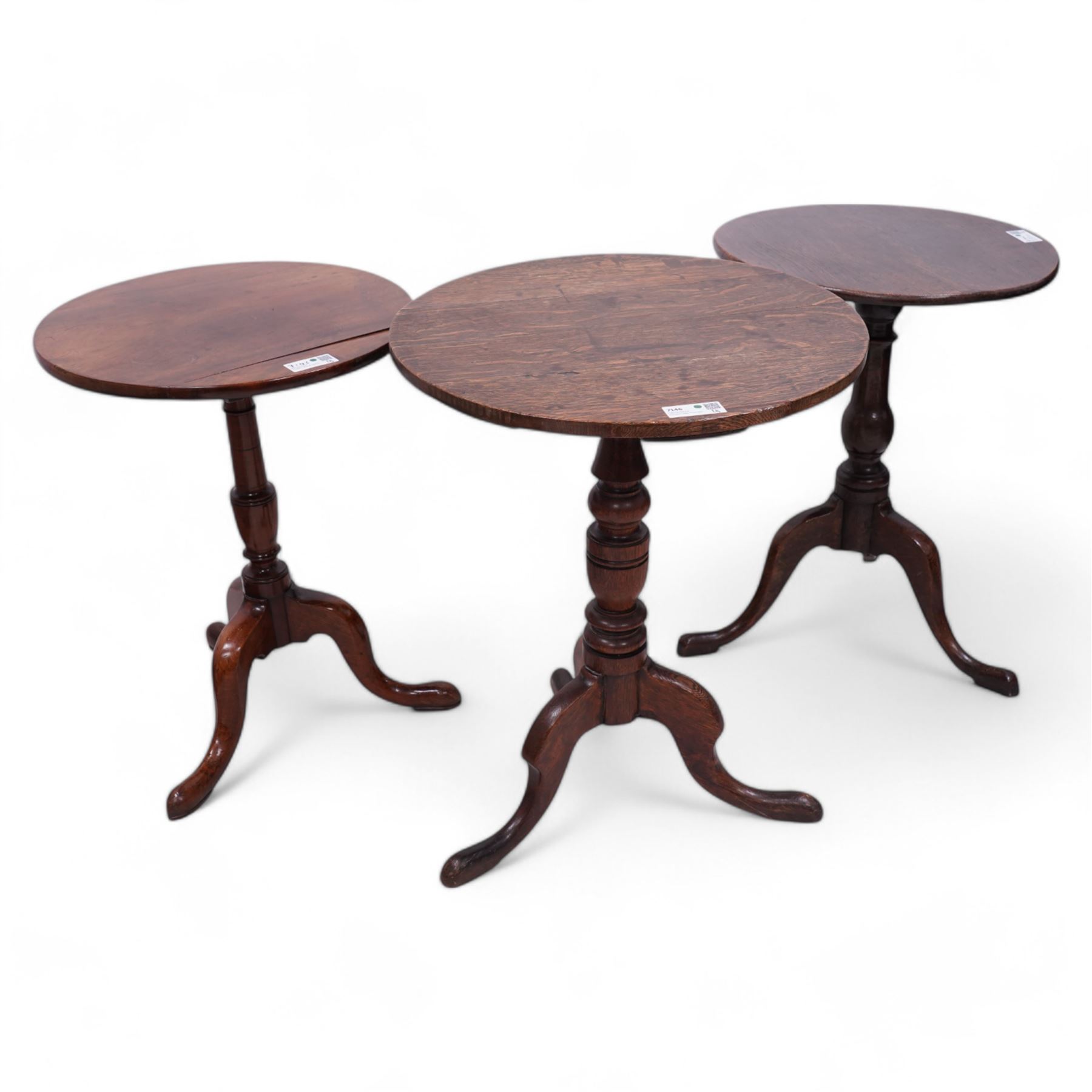 Three 18th century tripod tables - George III oak tripod table, circular tilt-top on vasiform pedestal (D51cm, H68cm); George III oak tripod table, circular tilt-top on ring turned pedestal (D58cm, H73cm); George III mahogany tripod table, circular tilt-top on vasiform pedestal (D50cm, H67cm)