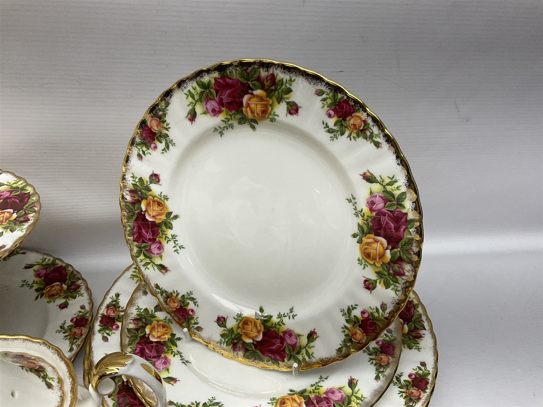 Royal Albert Old Country Roses pattern coffee service for six, comprising coffee pot, milk jug, cups and saucers, cake plate, together with miniature teapot, six teacups and saucers, six dinner plates, six side plates etc 