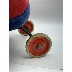 Steiff child's ride on ladybird, circa 1950s, the mohair body with red and black spotted seat, black and white face and blue underbelly, upon a metal frame with rubber and metal wheels, H30cm, W52cm