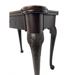 Late 18th century Irish mahogany tea table, rectangular form with projecting stepped rounded corners, fold-over action top over single frieze drawer within cock-beaded surround, on shell and bellflower carved cabriole supports, single gate-leg action base 