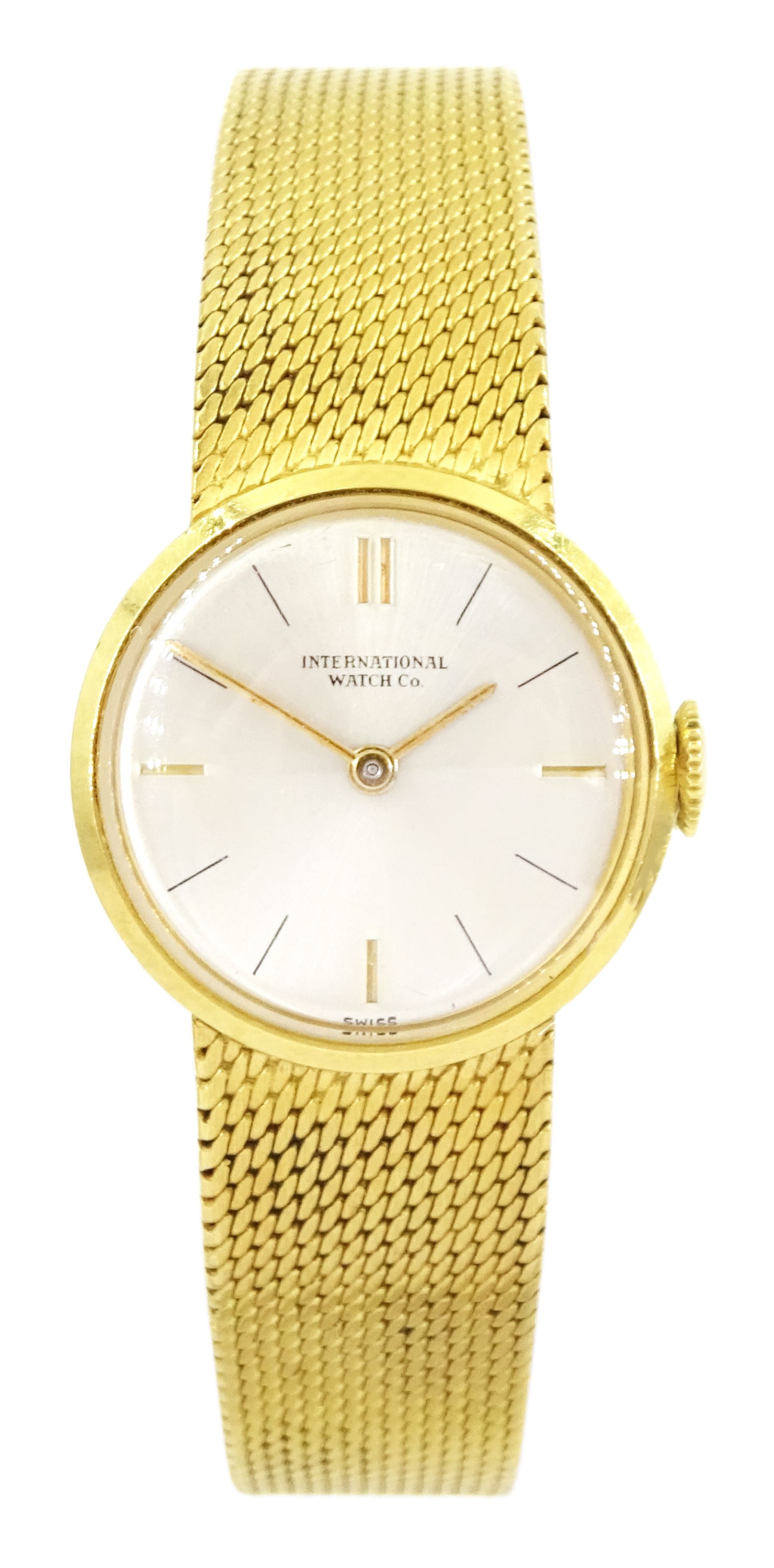 International Watch Company ladies 18ct gold manual wind wristwatch, silvered dial with baton hour markers, on integral 18ct gold bracelet, stamped 750, with guarantee dated 1968