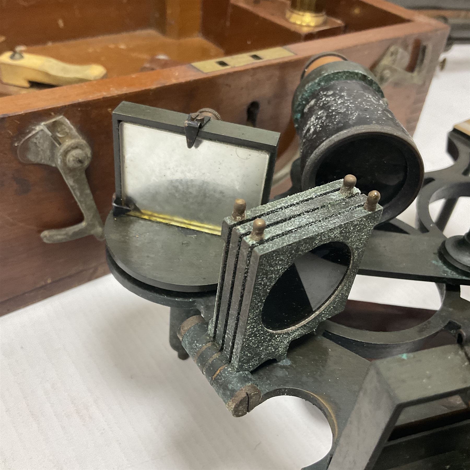 1940s Heath & Co brass and copper 'Hezzanith' sextant No. H412, in original oak carrying case, the inside lid with examination certificate dated 1942, together with a patinated brass miners level, in wooden box inscribed G.H Burrows