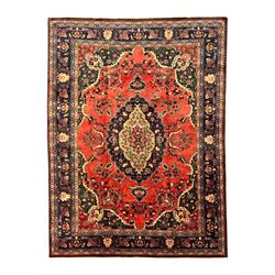 North East Persian Meshed crimson ground carpet, central indigo and green medallion with f...