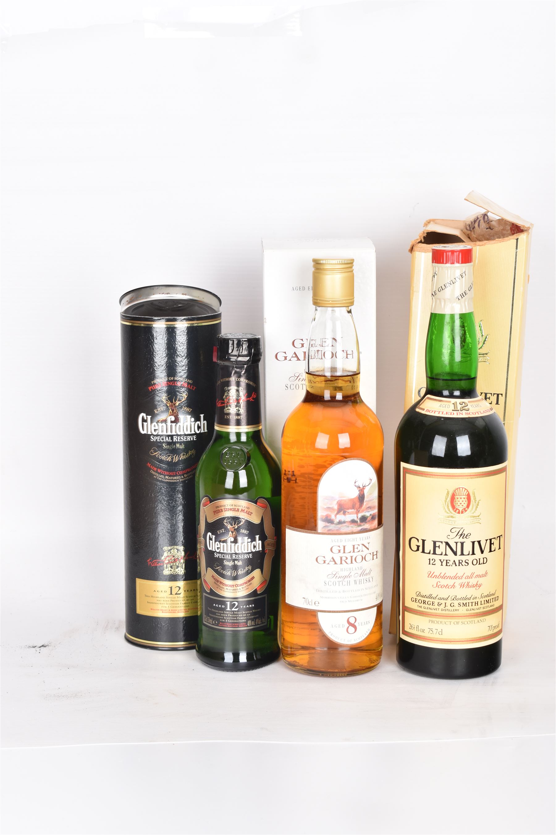 Three bottles of Scotch Whisky, including Glenlivet, 12 year old, Gen Garioch 8 year old and Glenfiddich 12 year old, various contents and proof 