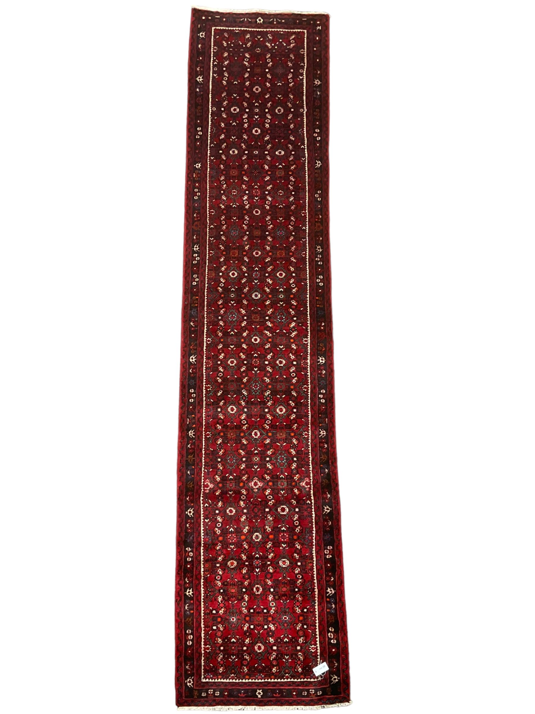 North West Persian Malayer runner, red ground field decorated with Herati motifs, guarded border decorated with trailing flowerhead band 