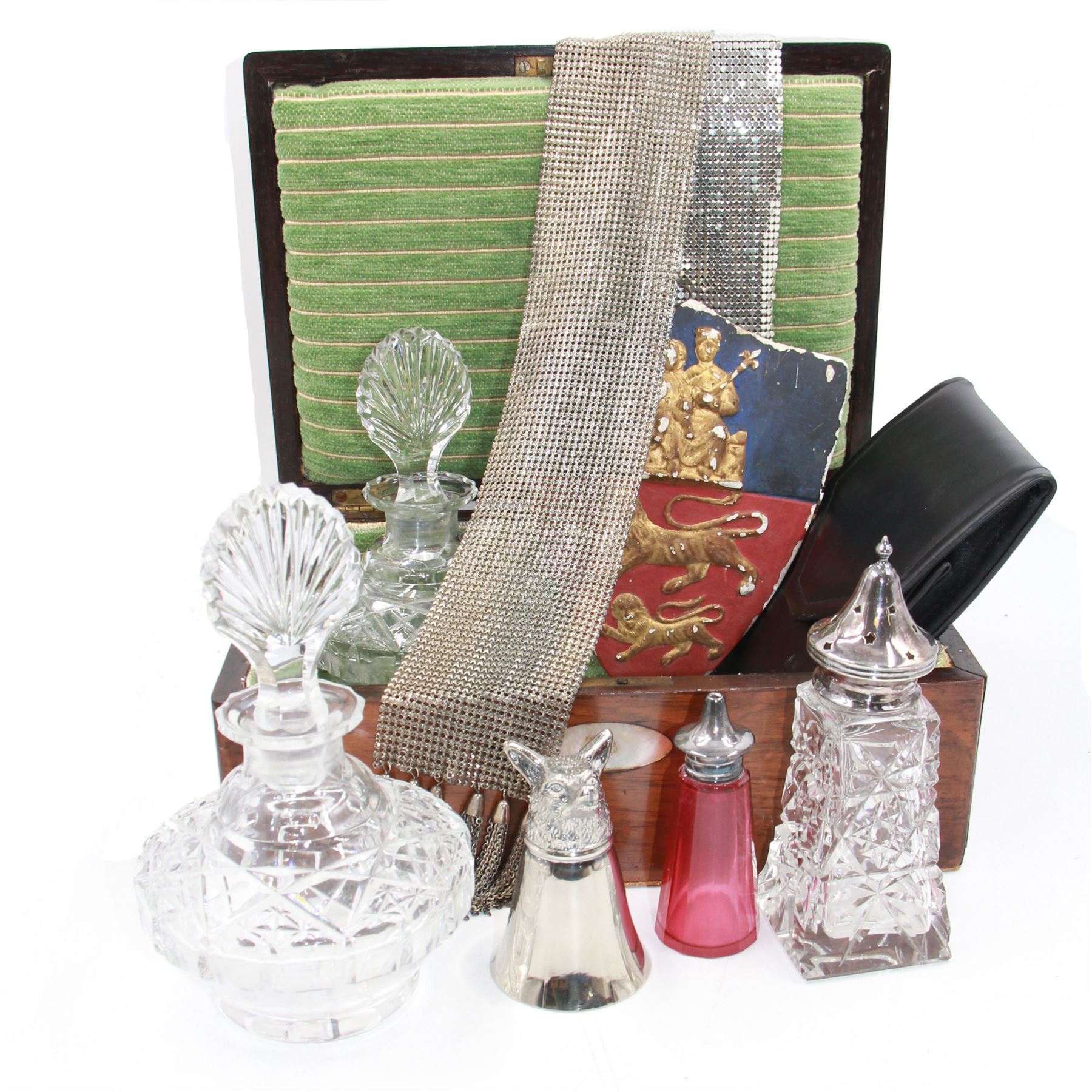 Two cut glass decanters, together with a faceted red glass bottle, cut glass sugar caster with pierced star cover, silver plated stirrup cup, chainmail scarf, plaster ships plaque and a walnut box with mother of pearl cartouche