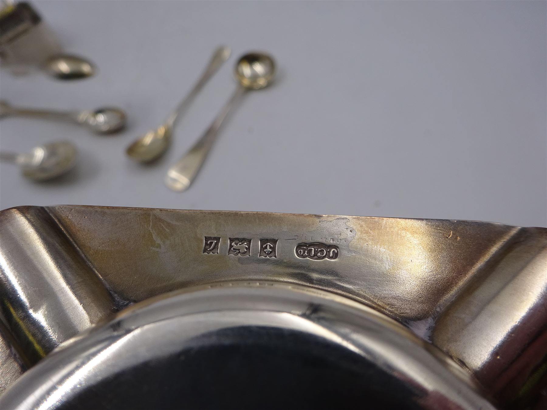 Group of silver, comprising ashtray, two napkin rings, sugar tongs and spoons, all hallmarked 