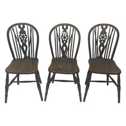 Set of six 19th century elm and ash dining chairs, hoop back with pierced wheel-shaped central splat, shaped saddle seat, raised on turned supports united by H-stretchers