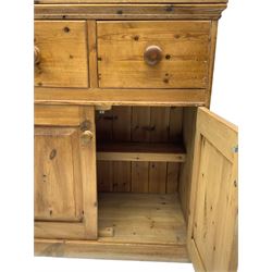 Solid pine dresser, fitted with plate rack above two drawers and two cupboards