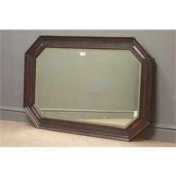  Early 20th century oak bevel edge wall mirror, carved and canted frame, W109cm, H74cm  