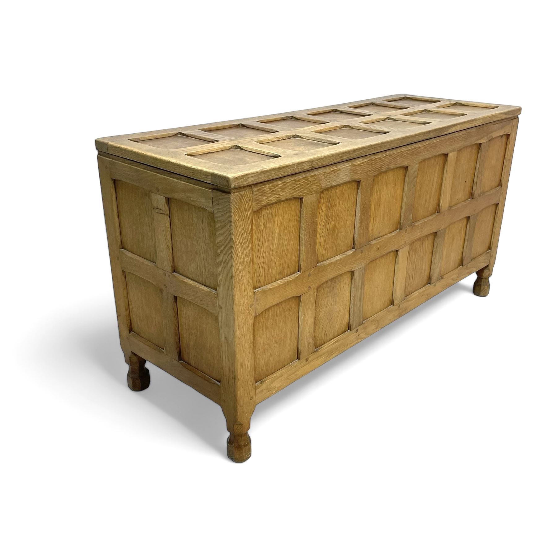 Sid Pollard (ex. Mouseman) - Yorkshire oak blanket chest, all over panelling, enclosed by hinged lid, on octagonal feet, interior plaque inscribed 'S. Pollard, Bagby, Thirsk, Yorks' 