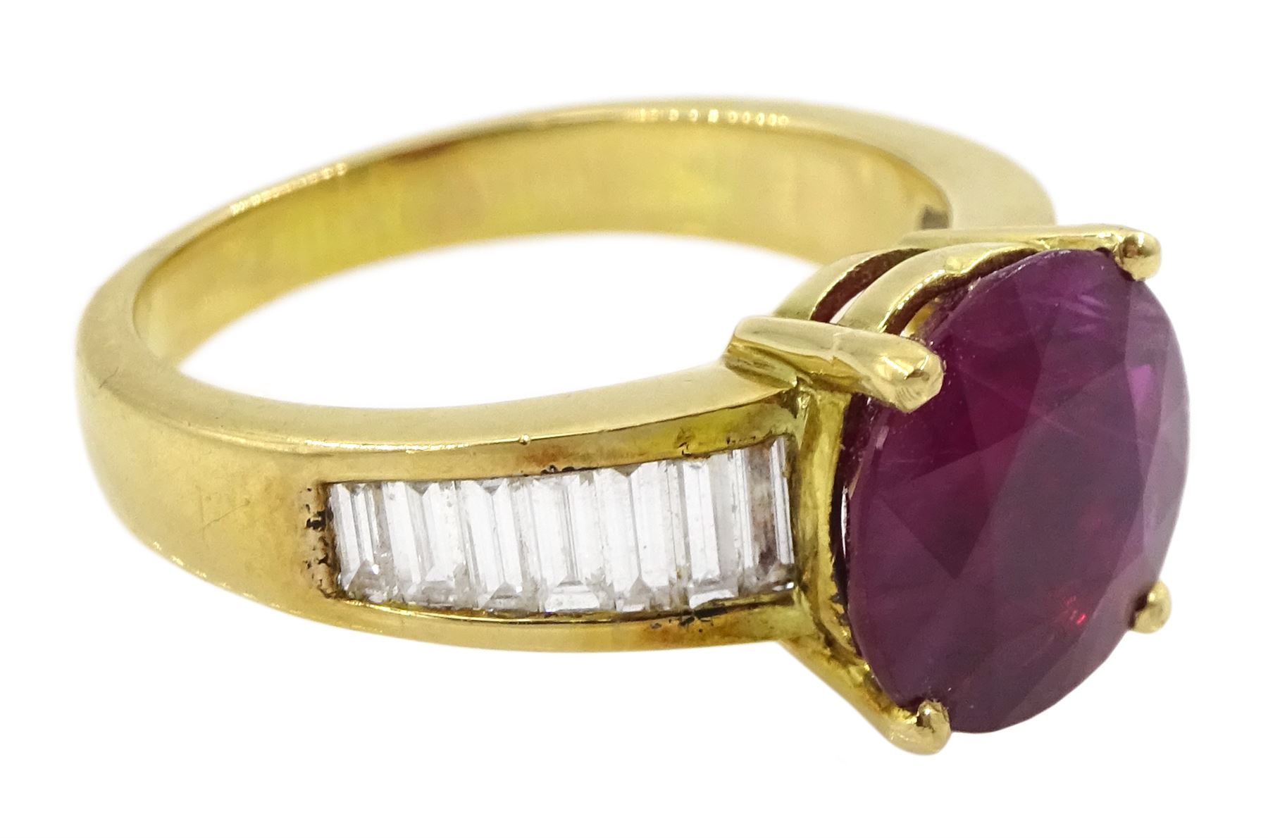 18ct gold single stone ruby ring, with channel set baguette cut diamond shoulders, ruby approx 3.25 carat, total diamond weight approx 0.85 carat