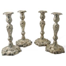 Set of four George III silver candlesticks, the stems embossed with flowers on moulded cir...