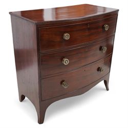 George III mahogany bow-fronted chest, shaped rectangular top with reed edge, fitted with three graduating cock-beaded drawers with brass pull handles, shaped apron over splayed bracket feet