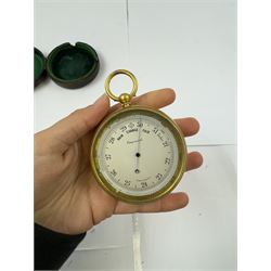 Lowdon Dundee, an early 20th century leather cased pocket barometer with silver dial, D4cm, together with another larger and later example, both cased